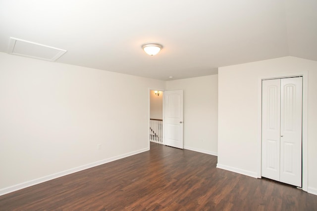 interior space with a closet and dark hardwood / wood-style flooring