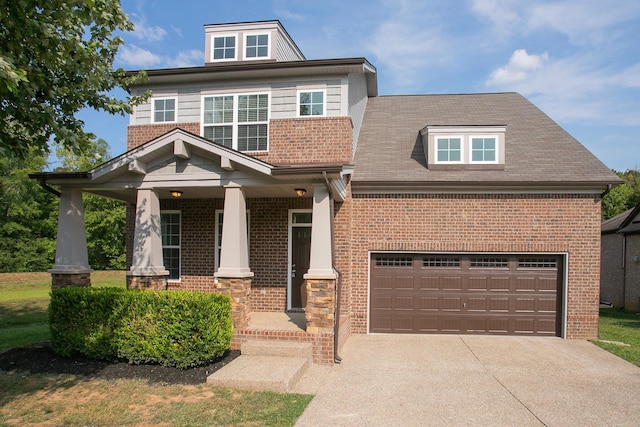 view of front of house featuring a garage and covered porch