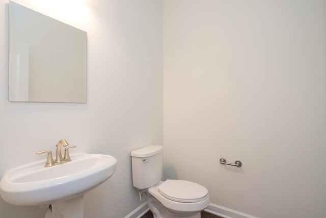 bathroom with sink and toilet