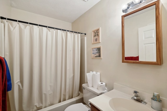 full bathroom with shower / bath combo, toilet, a textured ceiling, and vanity