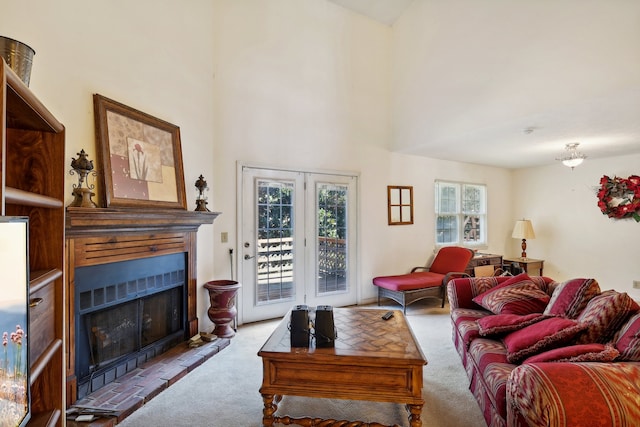 carpeted living room featuring a high ceiling