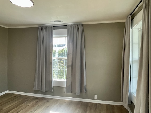 spare room with wood-type flooring