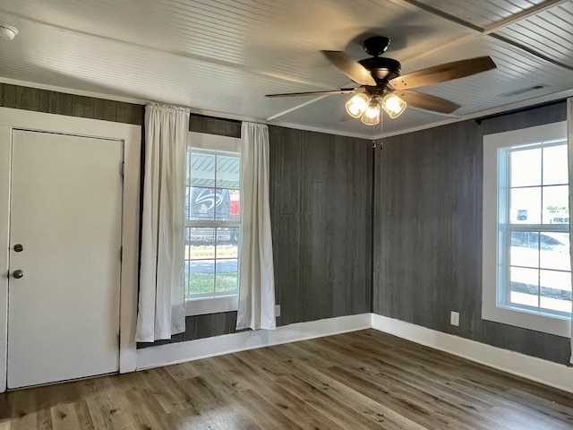 spare room with ceiling fan and wood-type flooring