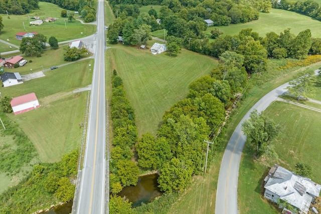 birds eye view of property with a rural view