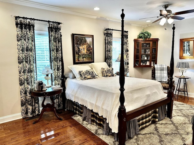 bedroom with ceiling fan, hardwood / wood-style floors, and ornamental molding