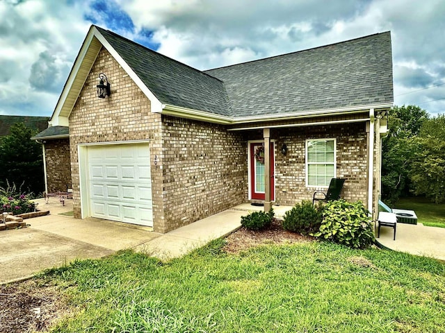 view of front of property featuring a garage and a front lawn