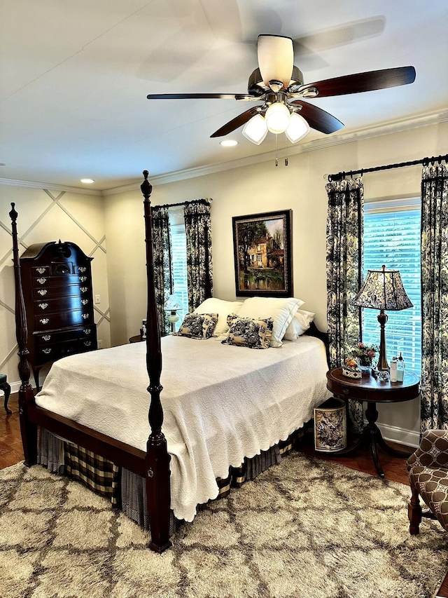 bedroom featuring ceiling fan and ornamental molding