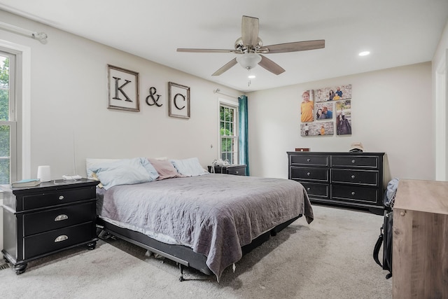 carpeted bedroom featuring ceiling fan