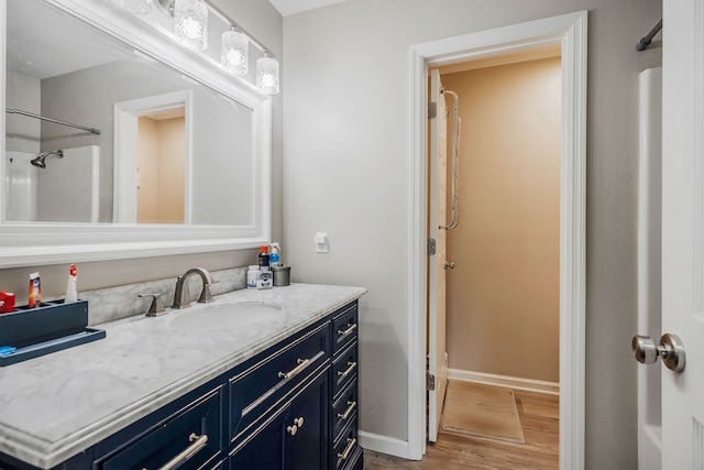 bathroom with wood-type flooring and vanity