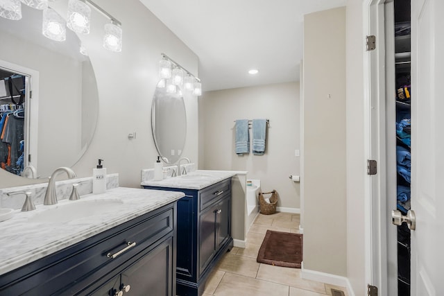 bathroom with tile patterned flooring and dual vanity