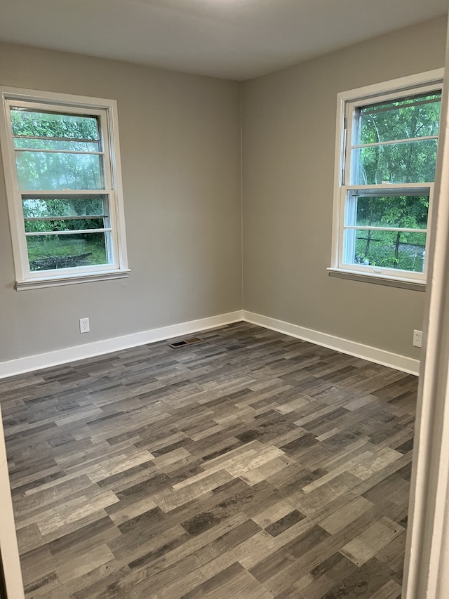 empty room featuring hardwood / wood-style flooring