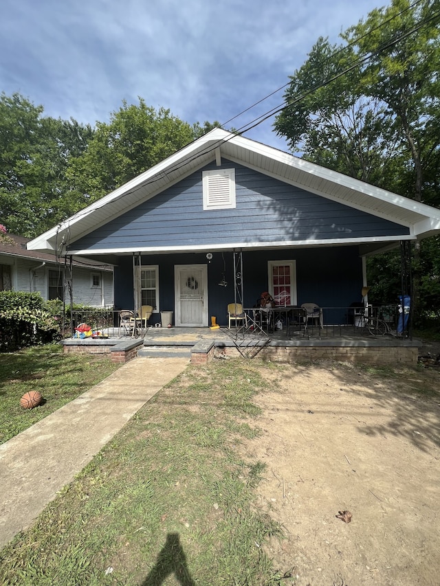 view of front of house featuring a front lawn and a porch