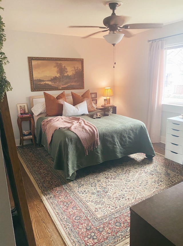 bedroom featuring ceiling fan and hardwood / wood-style flooring