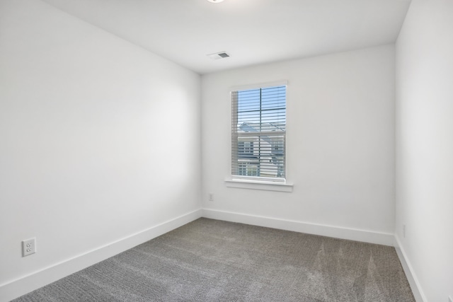 unfurnished room featuring carpet