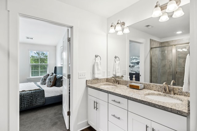 bathroom with an enclosed shower and vanity