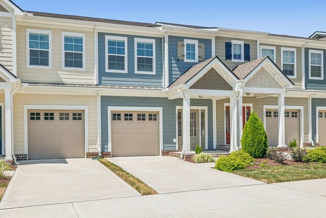 townhome / multi-family property featuring a garage