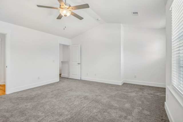 unfurnished bedroom with ceiling fan, carpet flooring, and lofted ceiling