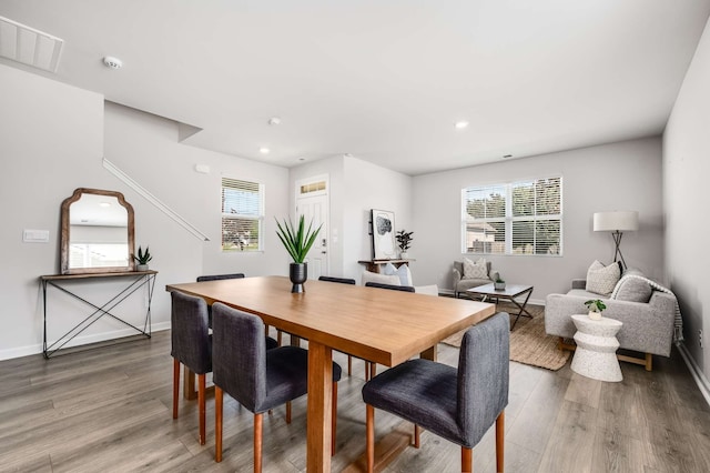 dining room with wood-type flooring