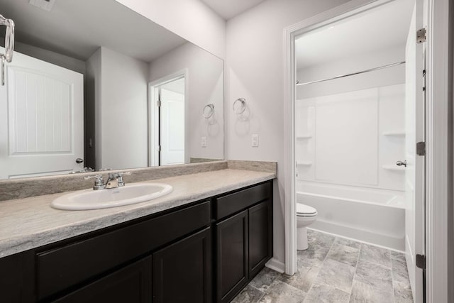 full bathroom with tile patterned flooring, toilet, washtub / shower combination, and vanity