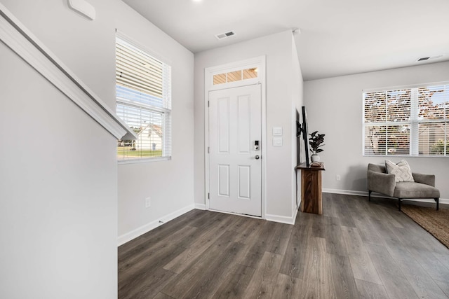 entryway with dark hardwood / wood-style floors