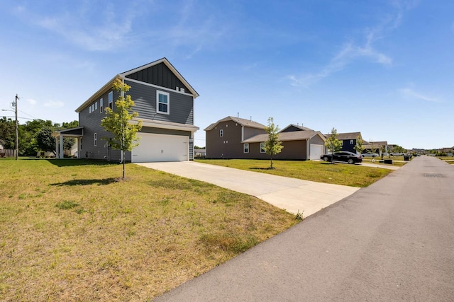 view of front of house featuring a garage and a front yard