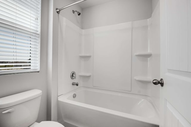 bathroom with shower / bathtub combination and toilet