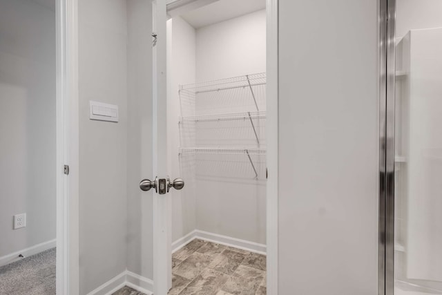 spacious closet with light tile patterned flooring