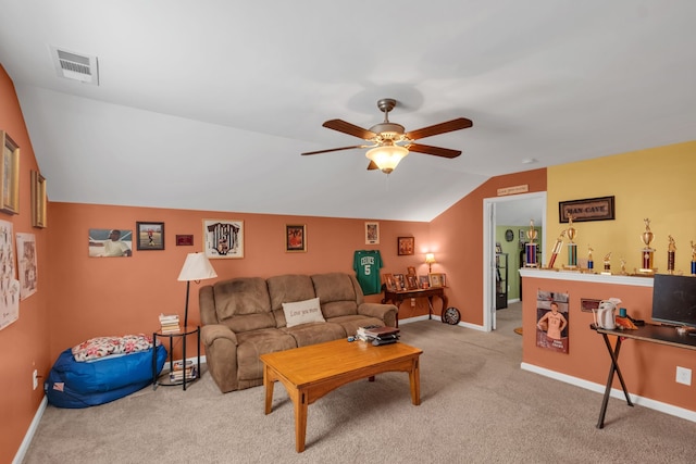 carpeted living room featuring ceiling fan and vaulted ceiling