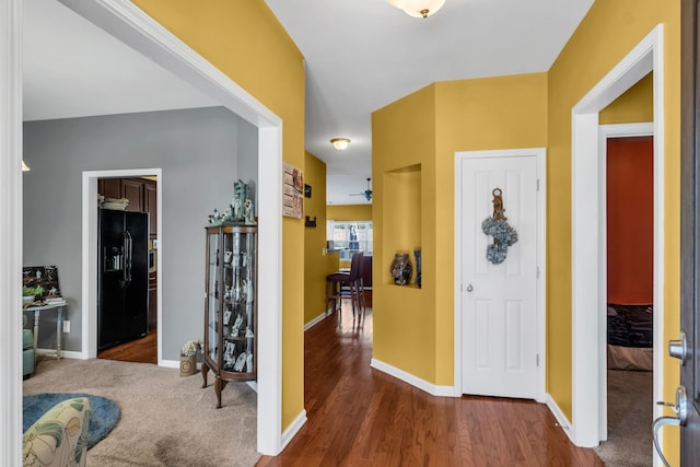 entrance foyer featuring ceiling fan and dark hardwood / wood-style floors