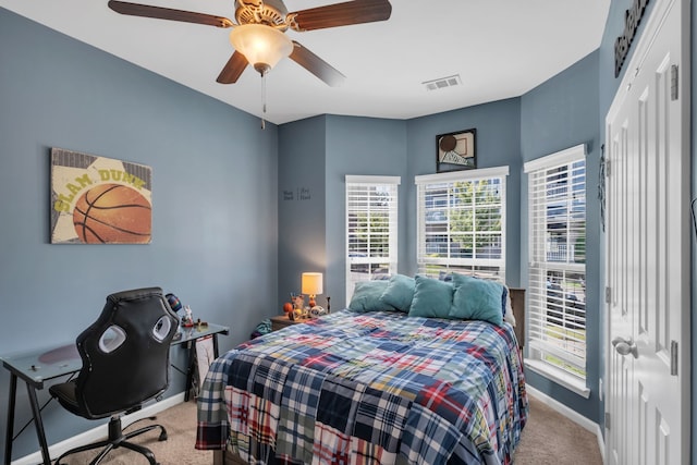 carpeted bedroom featuring ceiling fan