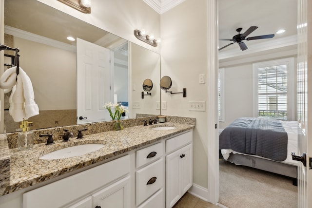 bathroom featuring ceiling fan, crown molding, and vanity