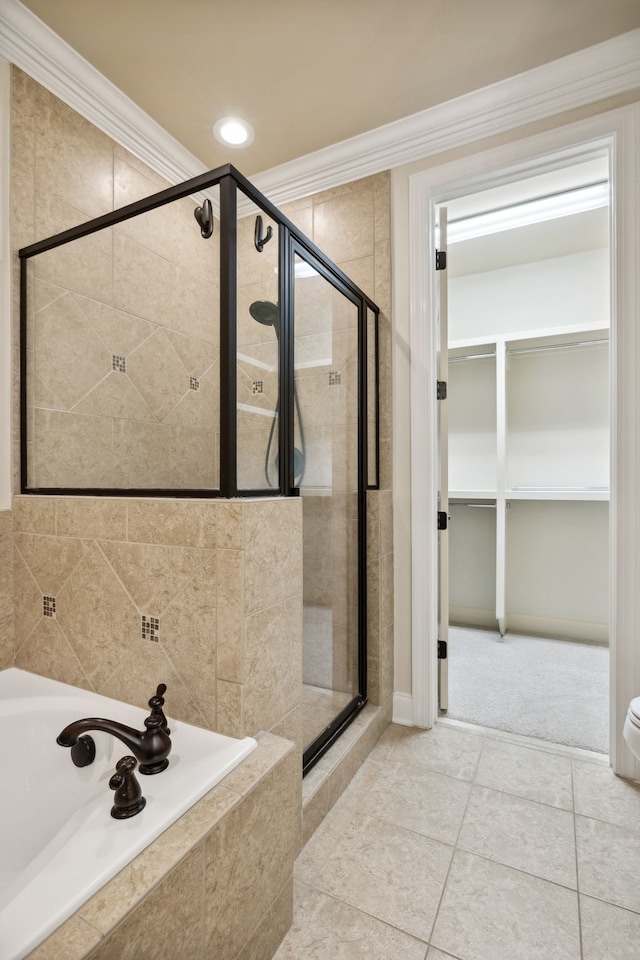 bathroom featuring tile patterned floors, shower with separate bathtub, and crown molding