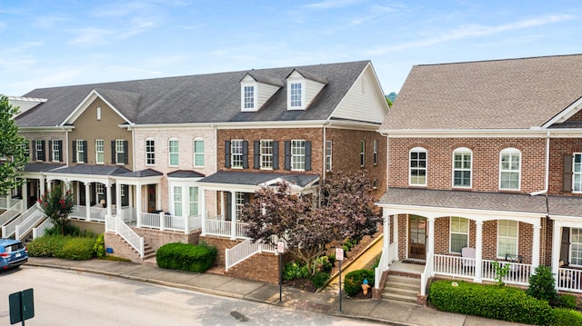 townhome / multi-family property with covered porch