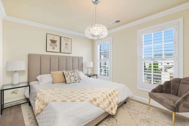 carpeted bedroom featuring an inviting chandelier, multiple windows, and crown molding