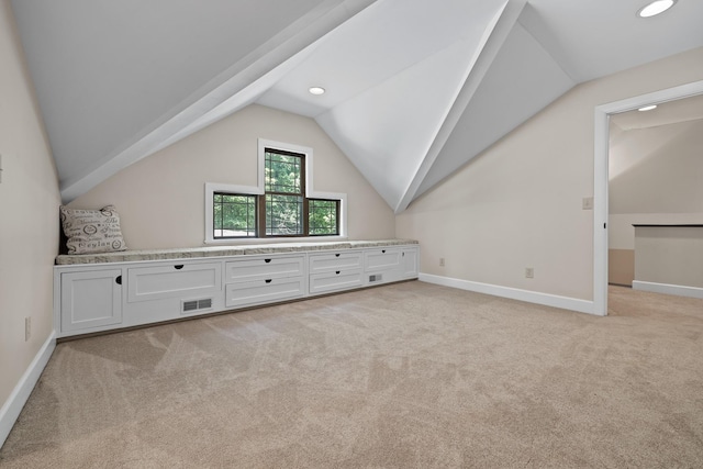 bonus room with lofted ceiling, visible vents, light carpet, and baseboards