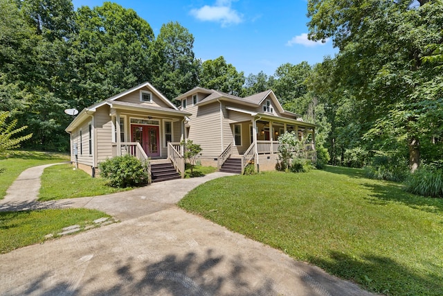 view of front facade featuring covered porch, a front lawn, and crawl space