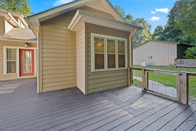 wooden deck featuring a lawn