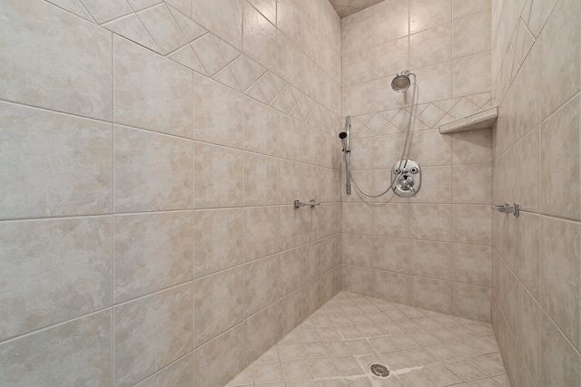 bathroom with a tile shower