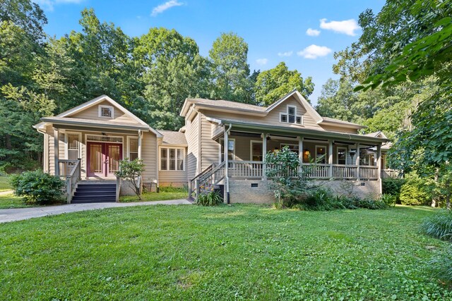 bungalow-style house featuring a front lawn and covered porch