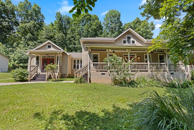 view of front of property featuring a porch, a front yard, and stairs