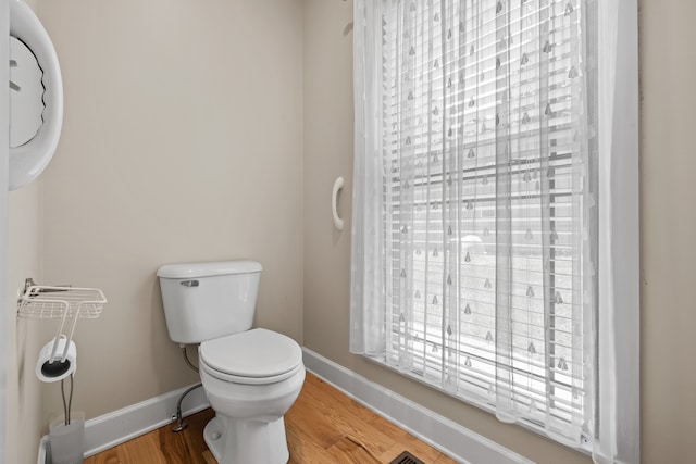 bathroom featuring toilet and hardwood / wood-style flooring