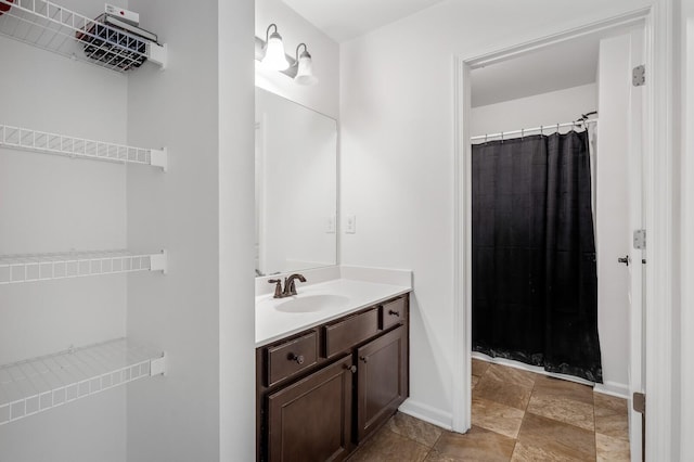 bathroom with vanity and walk in shower