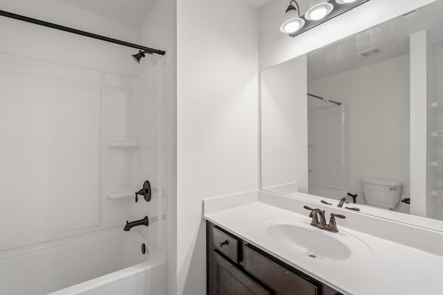 full bathroom with shower / bathing tub combination, vanity, and toilet