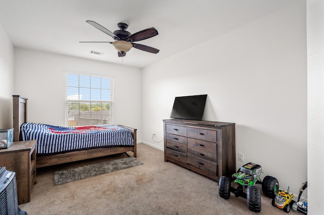 carpeted bedroom with ceiling fan