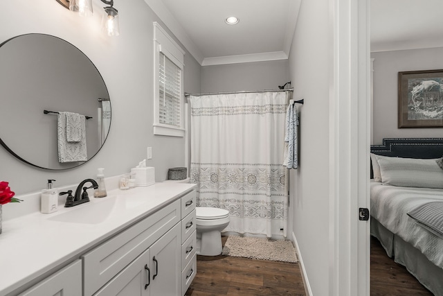 bathroom with vanity, crown molding, wood-type flooring, toilet, and a shower with curtain