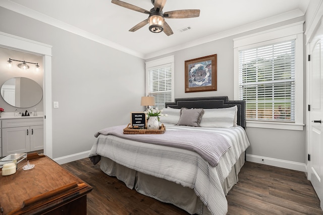 bedroom featuring ceiling fan, ornamental molding, dark hardwood / wood-style floors, and ensuite bathroom