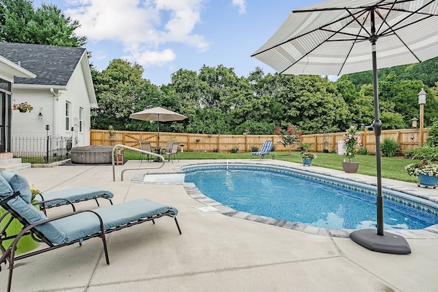 view of swimming pool with a patio area