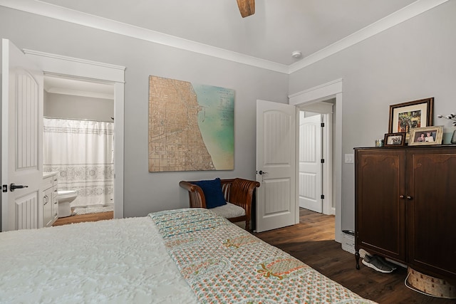 bedroom featuring ceiling fan, dark hardwood / wood-style floors, crown molding, and ensuite bath