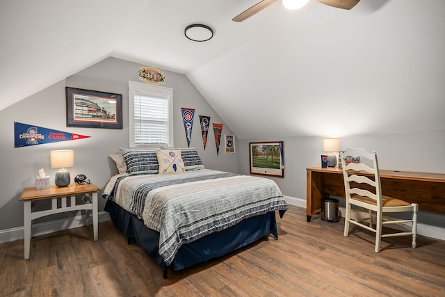 bedroom with ceiling fan, vaulted ceiling, and hardwood / wood-style flooring