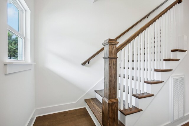 stairs with hardwood / wood-style floors